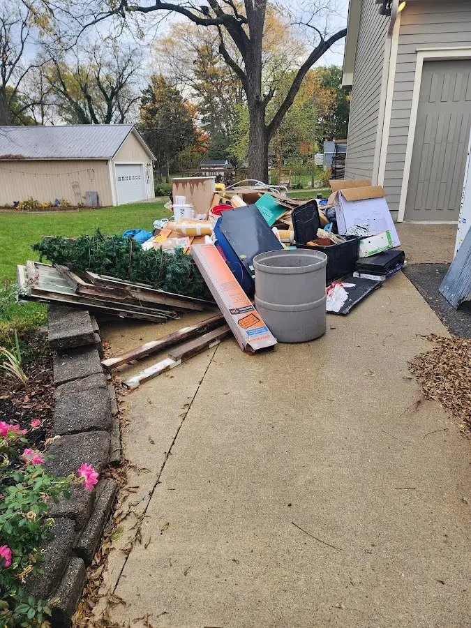 Dumpster being loaded with debris for 30 Yard Dumpster Rental in Smyrna